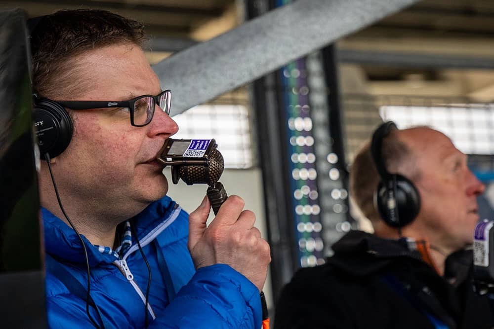 Commentator at football match